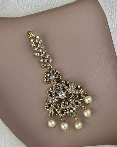Gold bracelet with pearls on a skin background